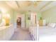 Comfortable bedroom with a decorative bed frame, ceiling fan, dresser, and bright natural light at 10801 Collar Dr, San Antonio, FL 33576