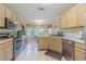Well-lit kitchen featuring stainless steel appliances, and a cozy breakfast nook at 10801 Collar Dr, San Antonio, FL 33576