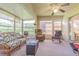 Spacious lanai featuring comfortable seating and plenty of natural light, perfect for relaxation at 10801 Collar Dr, San Antonio, FL 33576