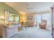 Bright and airy living room featuring comfortable seating, ceiling fan, and access to the lanai at 10801 Collar Dr, San Antonio, FL 33576