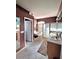 Bathroom featuring double sinks, a soaking tub, and walk-in shower at 10908 Sailbrooke Dr, Riverview, FL 33579