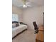 Neutral bedroom with a daybed, workspace and ceiling fan, ready for personalization and comfort at 10908 Sailbrooke Dr, Riverview, FL 33579