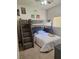 Fun bedroom with a unique bunk bed, a wicker headboard, and decorative wall art at 10908 Sailbrooke Dr, Riverview, FL 33579