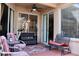 Covered patio with a ceiling fan and comfortable seating arrangements at 10908 Sailbrooke Dr, Riverview, FL 33579