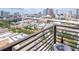 City view from balcony with lounge chair and beverage; enjoy a tranquil urban retreat at 1120 E Kennedy Blvd # 1512, Tampa, FL 33602