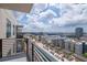 Stunning balcony view overlooking the pool and cityscape on a sunny day with cloudy skies at 1120 E Kennedy Blvd # 1512, Tampa, FL 33602