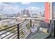 Relaxing balcony view with a cozy lounge chair, beverage, and a scenic city panorama at 1120 E Kennedy Blvd # 1512, Tampa, FL 33602