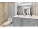 Bathroom with double sink vanity, large mirror, and glass-enclosed shower at 1120 E Kennedy Blvd # 1512, Tampa, FL 33602