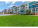 Apartment building with balconies, palm trees and a verdant lawn by the pool at 1120 E Kennedy Blvd # 1512, Tampa, FL 33602