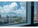 Stunning city view framed by a large window, offering a picturesque backdrop to urban living from a high-rise condominium at 1120 E Kennedy Blvd # 1512, Tampa, FL 33602