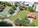Aerial view of community amenities includes a tennis court, shuffleboard, putting green, dog park, and covered picnic area at 1120 E Kennedy Blvd # 1512, Tampa, FL 33602