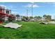 Scenic view of a community park with modern sculptures, lush green grass, palm trees, and a vibrant urban landscape at 1120 E Kennedy Blvd # 1512, Tampa, FL 33602