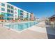 Large community pool with sundeck and plenty of lounge seating for relaxing in the sun with views of building at 1120 E Kennedy Blvd # 1512, Tampa, FL 33602