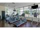 Community gym and fitness center with top-of-the-line equipment and panoramic windows overlooking tropical landscaping at 1120 E Kennedy Blvd # 1512, Tampa, FL 33602