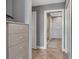 Hallway leading to a modern shower, a closet and grey toned walls at 1120 E Kennedy Blvd # 1512, Tampa, FL 33602