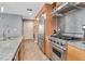 Gourmet kitchen featuring granite countertops, stainless steel appliances, and a gas range oven at 1120 E Kennedy Blvd # 1512, Tampa, FL 33602