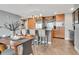 Gourmet kitchen with granite countertops, stainless steel appliances, an island, and a dining table at 1120 E Kennedy Blvd # 1512, Tampa, FL 33602