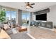 Living room featuring wall-mounted TV and floor-to-ceiling windows with a city view at 1120 E Kennedy Blvd # 1512, Tampa, FL 33602