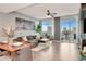 Bright living room with floor-to-ceiling windows, wood floors and city views at 1120 E Kennedy Blvd # 1512, Tampa, FL 33602