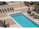 Community rooftop pool with lounge chairs and tables offering a relaxing outdoor space for residents at 1120 E Kennedy Blvd # 1512, Tampa, FL 33602