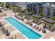 An overhead shot of the community pool in the complex, featuring lounge chairs and tables at 1120 E Kennedy Blvd # 1512, Tampa, FL 33602