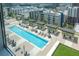 Bright aerial view capturing the pool area with lounge chairs and umbrellas, showcasing relaxation at 1120 E Kennedy Blvd # 1512, Tampa, FL 33602