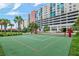 Outdoor sand volleyball court, perfect for recreation and sports with modern highrise in background and palm trees at 1120 E Kennedy Blvd # 1512, Tampa, FL 33602