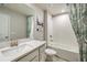 Bathroom features a combination shower and tub with modern fixtures and stylish finishes at 1124 Creek Valley Ct, Brandon, FL 33511