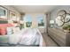 Sunlit main bedroom features stylish decor, large windows, and elegant furnishings at 1124 Creek Valley Ct, Brandon, FL 33511