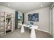 Bright home office with a large desk, modern decor, and serene view at 1124 Creek Valley Ct, Brandon, FL 33511