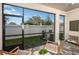 Screened lanai with comfortable seating overlooks the green lawn and offers seamless outdoor enjoyment at 1124 Creek Valley Ct, Brandon, FL 33511