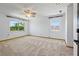 Spacious bedroom with light-colored carpet and white walls gets great natural light at 11285 8Th E St, Treasure Island, FL 33706