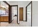 Hallway featuring views into kitchen, living spaces, and bedrooms at 11285 8Th E St, Treasure Island, FL 33706