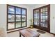 Living room with water view from large window and door to back porch at 11285 8Th E St, Treasure Island, FL 33706