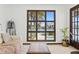 Bright living room with a view of the canal and pool, offering a serene and relaxing atmosphere at 11285 8Th E St, Treasure Island, FL 33706