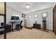 Carpeted bonus room, complete with desk, storage, and exercise equipment at 11285 8Th E St, Treasure Island, FL 33706
