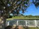 A white picket fence encloses the backyard offering water views and privacy at 11420 Bridge Pine Dr, Riverview, FL 33569