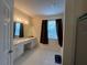 Bright bathroom with vanity, tile floors, shower over tub, and lots of natural light at 11420 Bridge Pine Dr, Riverview, FL 33569