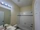 Bright bathroom featuring a shower-tub combination with white tile surround at 11420 Bridge Pine Dr, Riverview, FL 33569