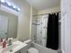 Bright bathroom featuring a shower-tub combination with white tile surround at 11420 Bridge Pine Dr, Riverview, FL 33569