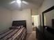 Cozy bedroom featuring a ceiling fan, comfortable bed, and ample closet space at 11420 Bridge Pine Dr, Riverview, FL 33569