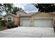 Charming single-story home features a two-car garage and landscaped front yard with a well-maintained lawn at 11420 Bridge Pine Dr, Riverview, FL 33569