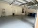 Clean and spacious two-car garage provides ample parking and storage space, along with a door to the house at 11420 Bridge Pine Dr, Riverview, FL 33569