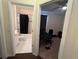 Hallway view to full bathroom and spare bedroom at 11420 Bridge Pine Dr, Riverview, FL 33569