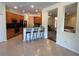 Open kitchen featuring wood cabinets, breakfast bar with seating, and stainless steel appliances at 11420 Bridge Pine Dr, Riverview, FL 33569