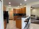 Kitchen boasts modern appliances, breakfast bar seating, and an open layout to the living area at 11420 Bridge Pine Dr, Riverview, FL 33569