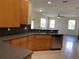 Open kitchen design with stainless steel appliances and countertop extending into breakfast bar at 11420 Bridge Pine Dr, Riverview, FL 33569