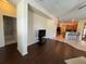 Bright living room featuring a combination of tile and hardwood floors, with easy access to the kitchen at 11420 Bridge Pine Dr, Riverview, FL 33569