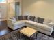 Cozy living room featuring a comfortable sectional sofa, rug, and a stylish coffee table at 11420 Bridge Pine Dr, Riverview, FL 33569