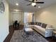 Open-concept living area with a dining table, sectional sofa, and modern furnishings at 11420 Bridge Pine Dr, Riverview, FL 33569